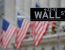 FILE PHOTO: A street sign for Wall Street is seen outside the New York Stock Exchange (NYSE) in Manhattan, New York City, U.S. December 28, 2016. REUTERS/Andrew Kelly/File Photo