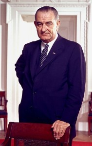 377px-Lyndon_B._Johnson,_photo_portrait,_leaning_on_chair,_color_cropped