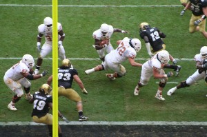 "Vince Young scores a touchdown in the 2005 Big 12 Championship Game". Licensed under CC BY-SA 3.0 via Wikimedia Commons.