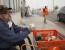 U.S. Marine Corps veteran Martin Silverhawk sits outside a Home Depot store, where he has been living since evacuating his home, during the Okanogan Complex fire in Omak, Washington August 25, 2015. In north-central Washington, a cluster of deadly fires dubbed the Okanogan Complex has burned more than 258,339 acres (104,546 hectares), overtaking last year